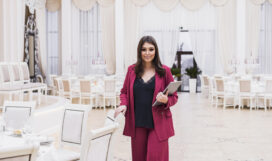 event-manager-with-laptop-in-banquet-hall